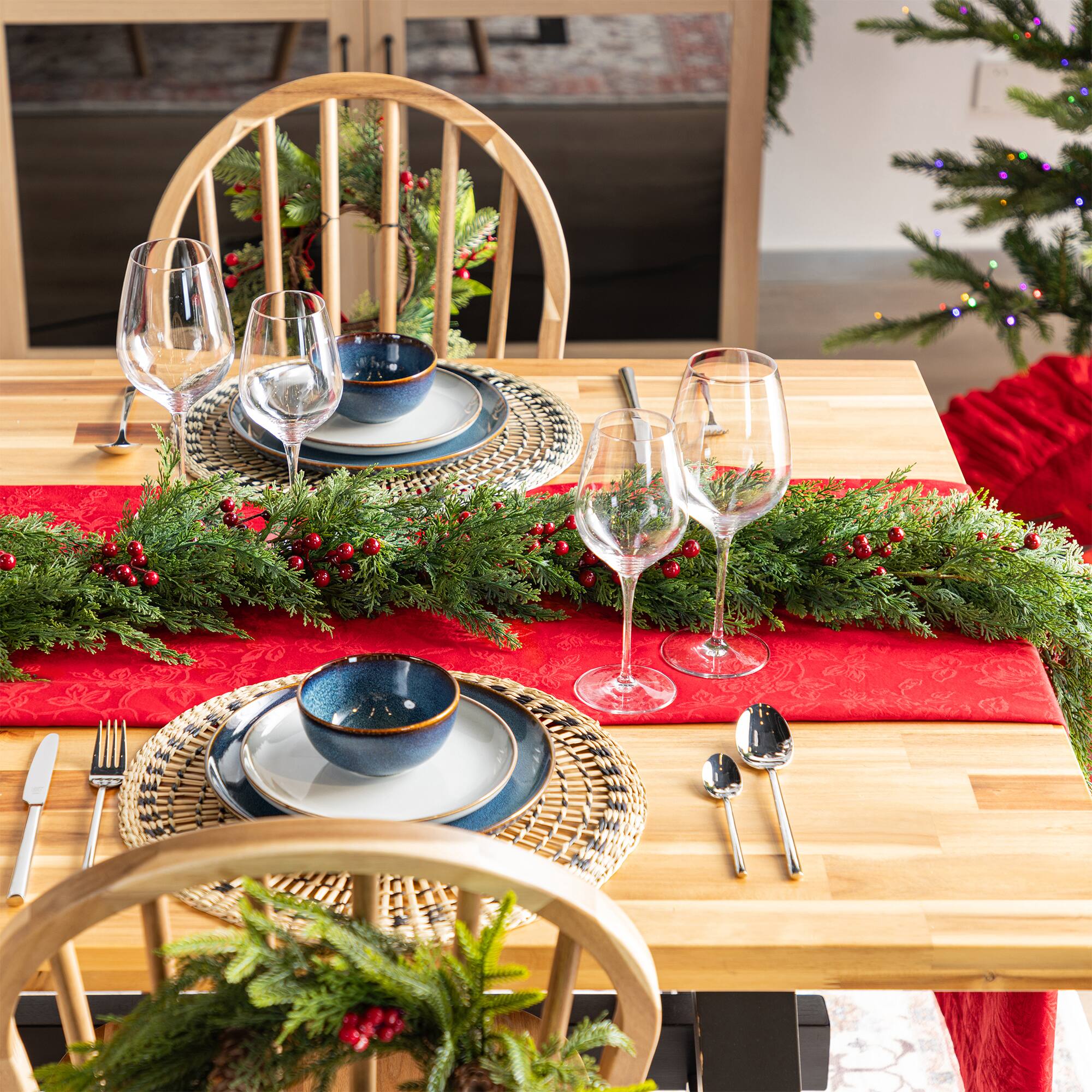 Glitzhome® 9ft Christmas Greenery PE Cedar Garland with Red Berries